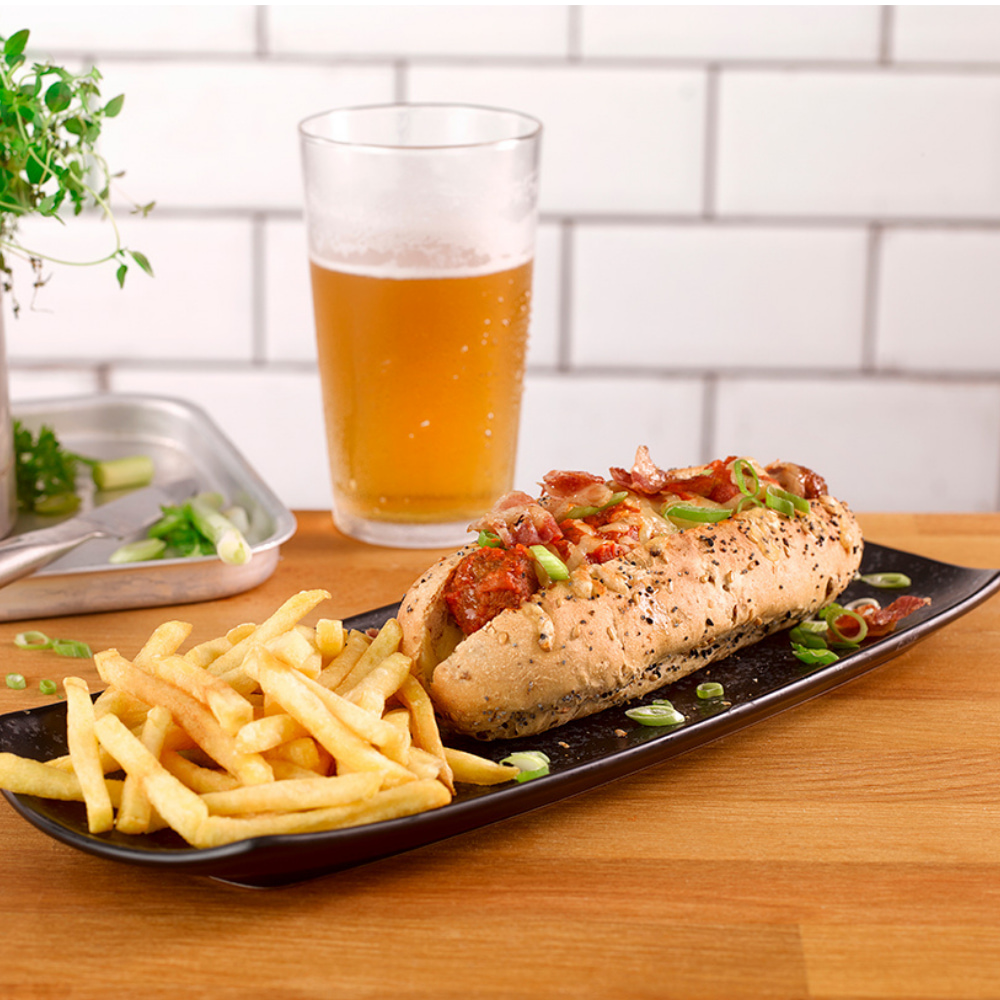 Meatball sub with spring onion, fries and a pint of beer